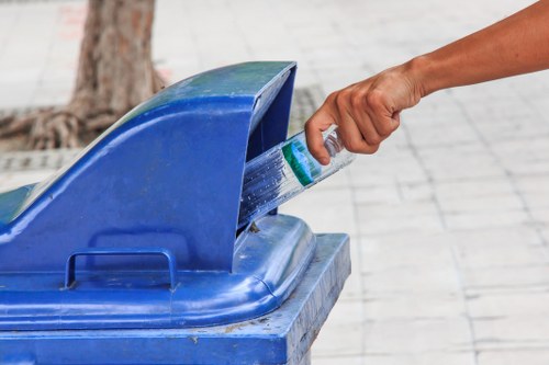 Crew separating recyclables and electronics at a mid-clearance sorting point