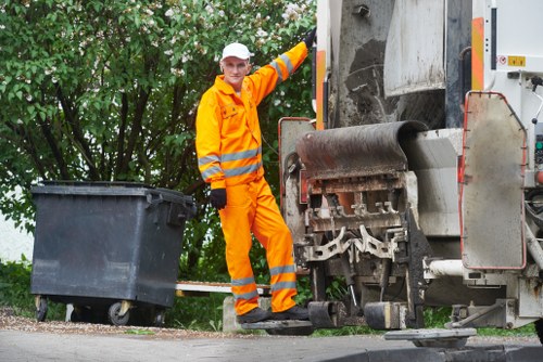 Operatives handling a house clearance with a van in the background